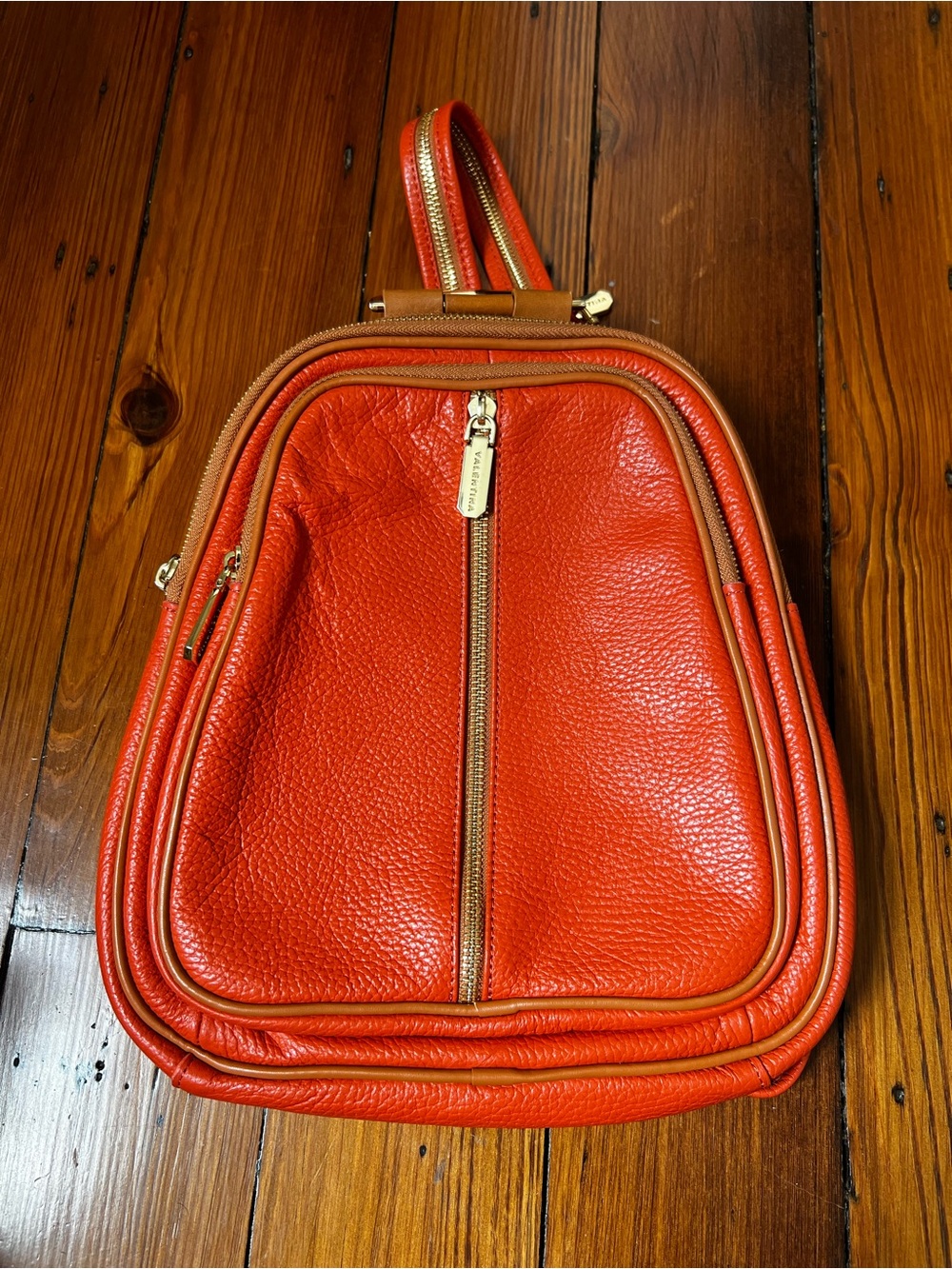 Valentina pebbled orange and tan Italian leather convertible backpack